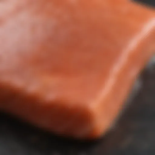 Close-up of vibrant farm-raised salmon fillet showcasing its rich color