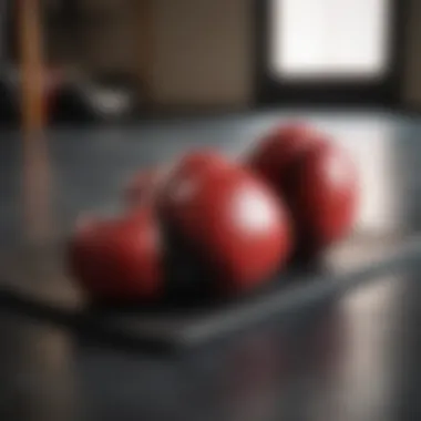 Comfort and Safety in Training A pair of boxing gloves resting on a training mat, symbolizing safety and comfort in training