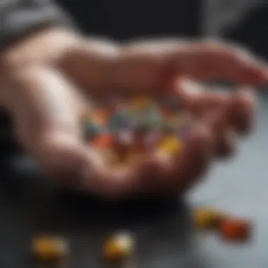 A close-up of a hand holding various vitamin supplements